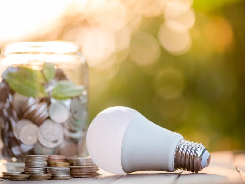 led next to jar of coins