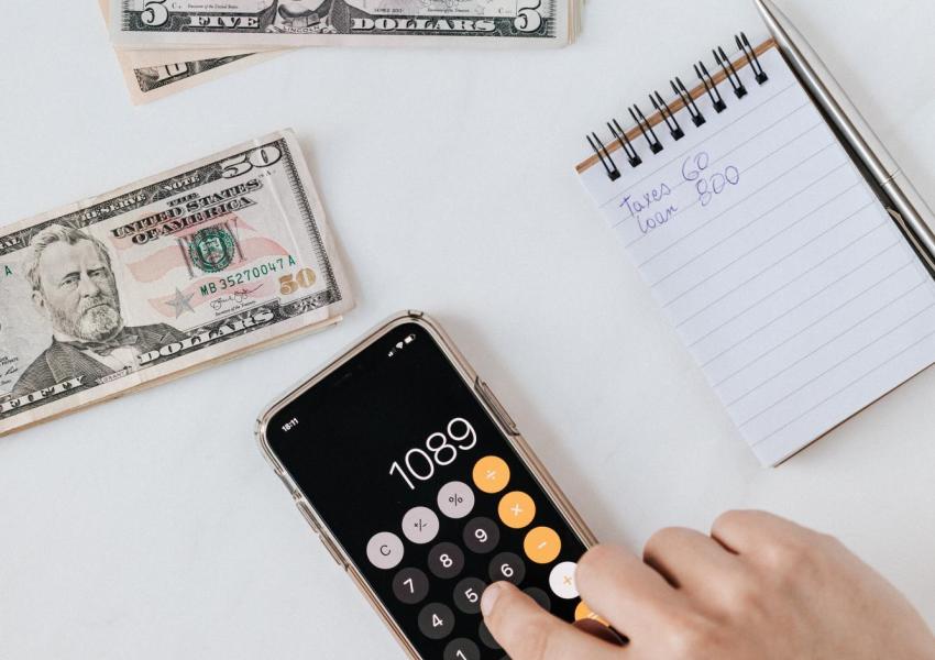 Calculator and money.